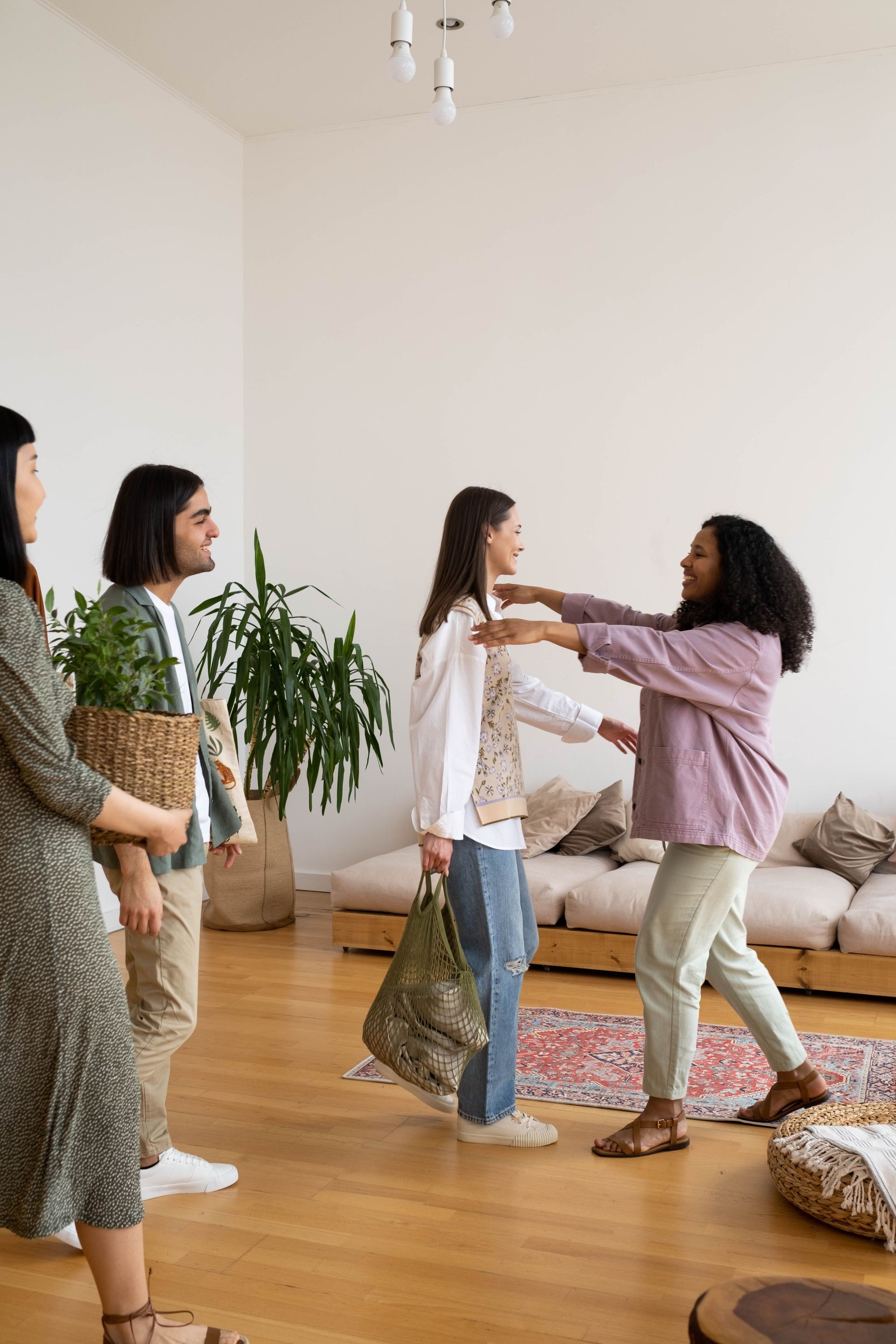 A cheerful indoor gathering with friends exchanging plants, bringing life and greenery to a cozy space.