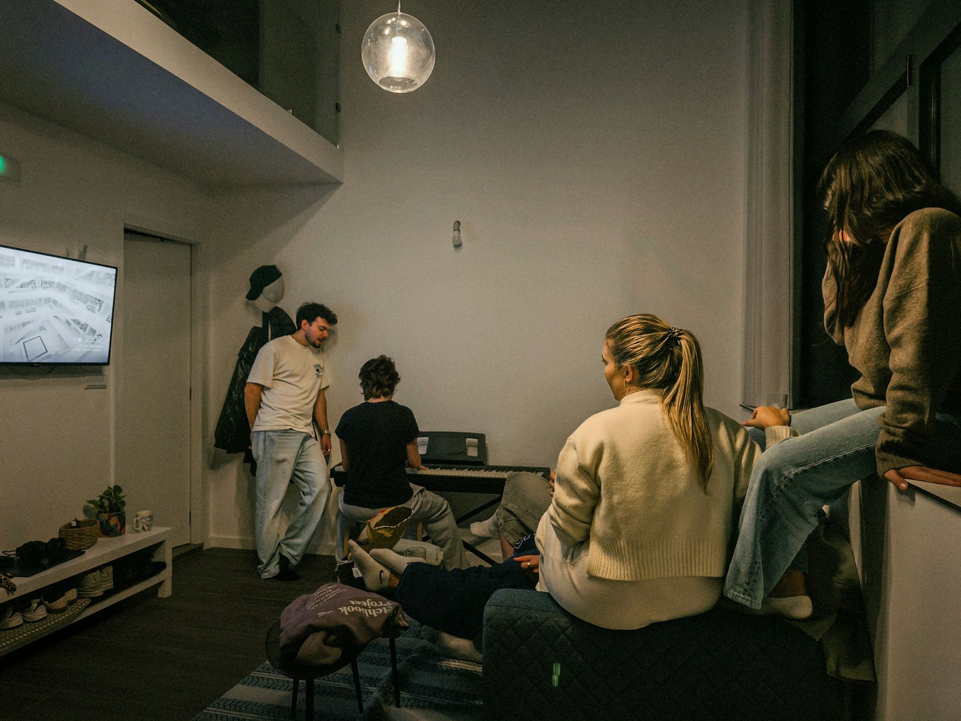 Group of friends relaxing in a modern living room.